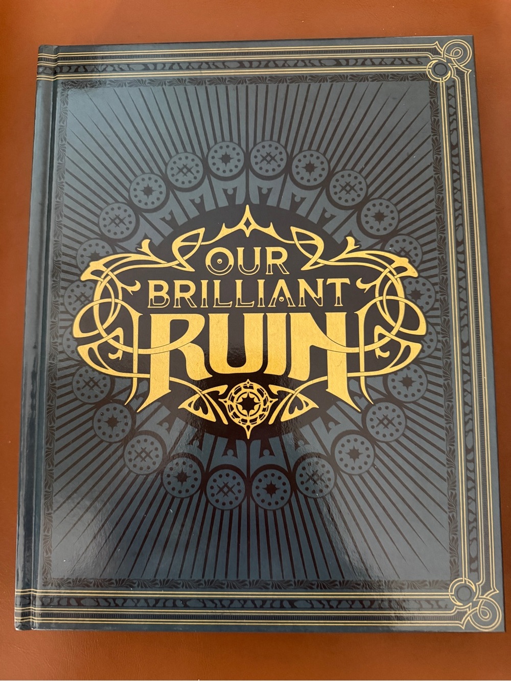 Our Brilliant Ruin Hardcover Book - Navy Blue & Gold